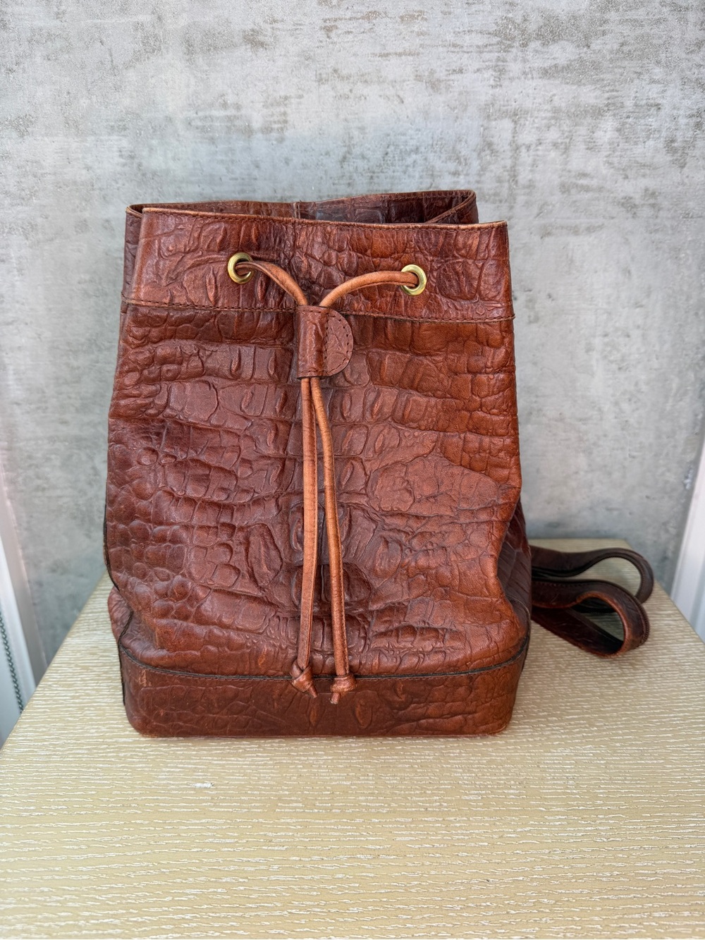 Croc-Embossed Brown Leather Drawstring Backpack by Silvia Fernandez